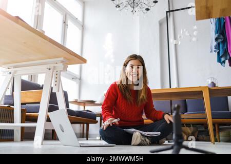 Young female vlogger making social media video Stock Photo