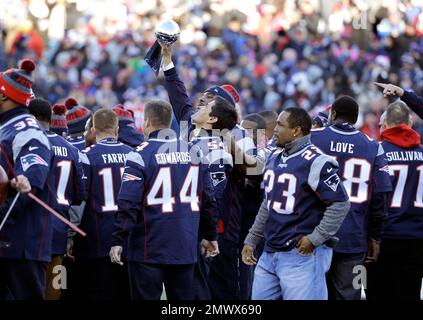 New England Patriots players from the 2001 Super Bowl championship team,  including Drew Bledsoe (11), Lawyer Milloy (36), Troy Brown (80), and David  Patten (86) react as they are honored during halftime