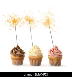 Birthday cupcakes with sparklers on white background Stock Photo