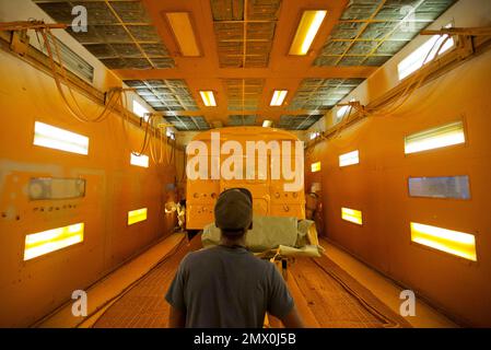 https://l450v.alamy.com/450v/2mx0j5b/for-use-as-desired-in-this-sept-18-2015-photo-workers-paint-a-school-bus-on-the-assembly-line-at-blue-bird-corporations-manufacturing-facility-in-fort-valley-ga-blue-bird-corporation-one-of-the-nations-leading-manufacturer-of-school-buses-employees-about-1600-workers-and-has-sold-more-than-550000-buses-since-its-formation-in-1927-ap-photodavid-goldman-2mx0j5b.jpg