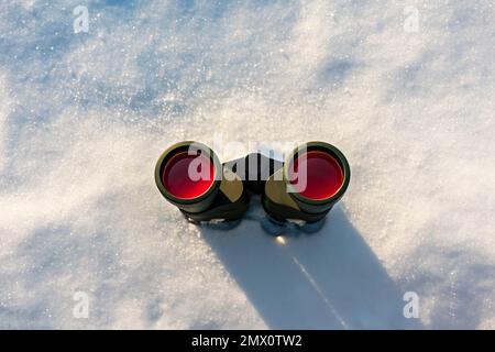 binoculars close-up on snow Birdwatching Stock Photo