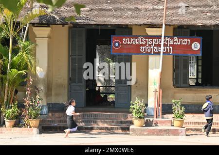 Students playing in the courtyard of a public school in Luang Prabang, Laos Stock Photo