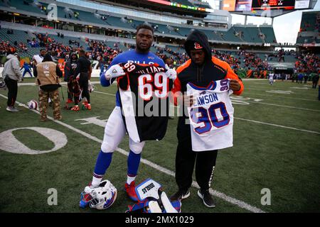 Buffalo Bills' Shaq Lawson, left, greets Denver Broncos' DeShawn