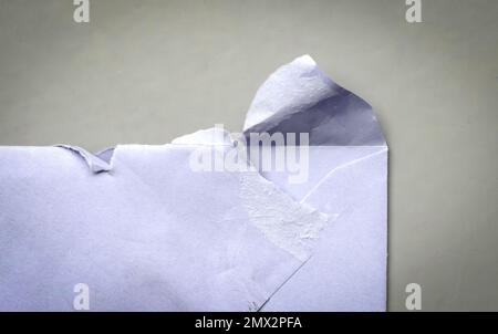 Torn (opened) envelope on a grey background Stock Photo