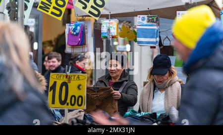 women looking for clothes in the stalls in the city. rome, italy. city life concept Stock Photo