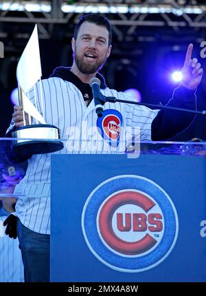 Chicago Cubs outfielder BEN ZOBRIST holds up his MVP trophy