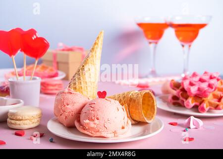 Pink ice cream cones with red sugar hearts shaped sprinkles. Valentines day concept Stock Photo
