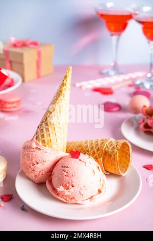 Pink ice cream cones with red sugar hearts shaped sprinkles. Valentines day concept Stock Photo