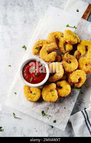 Homemade Popcorn shrimps breaded with cornmeal | Game day appetizer, selective focus Stock Photo