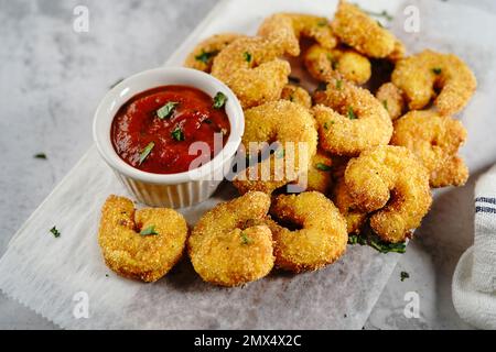 Homemade Popcorn shrimps breaded with cornmeal | Game day appetizer, selective focus Stock Photo