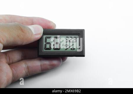 Analog Thermometer Hygrometer is used to measure room temperature and humidity. Hygrometer isolated on white background Stock Photo