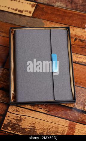 gray color fabric and leather customized diary mockup photography Stock Photo