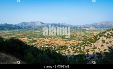 Panoramic view of Lasithi Plateau from Cave of Diktaion Andron. Amazing aerial view of famous Lasithi Plateau in Crete, Greece Stock Photo