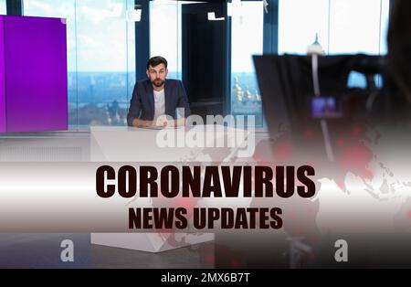 Presenter working in studio. Coronavirus pandemic - latest updates Stock Photo
