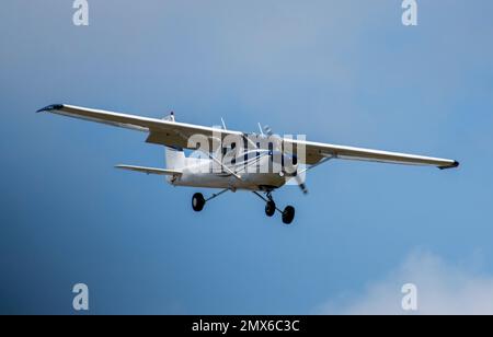 A small single prop airplane coming in for a landing at a local airport Stock Photo