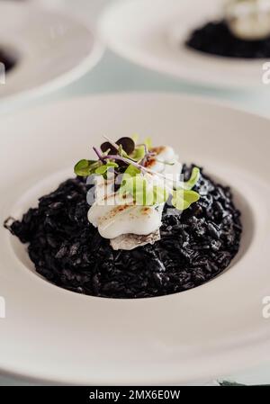Squid Ink Rce Squid tapa cooked in its ink Stock Photo - Alamy