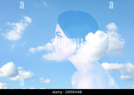 Double exposure of beautiful woman and blue sky. Concept of inner power Stock Photo