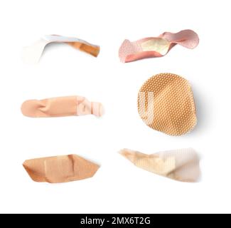 Set with used sticking plasters on white background, top view Stock Photo