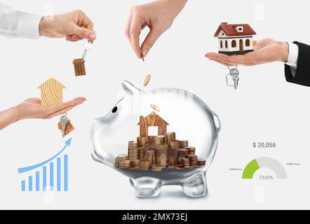 Woman putting coins into transparent piggy bank with house model on white background, closeup. Saving money for real estate Stock Photo