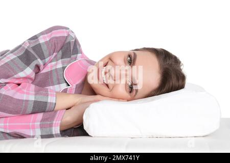 Young woman lying on orthopedic pillow against white background, closeup Stock Photo