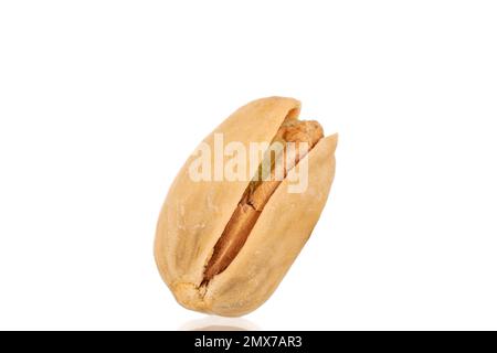 One unpeeled pistachio, close-up, isolated on white. Stock Photo