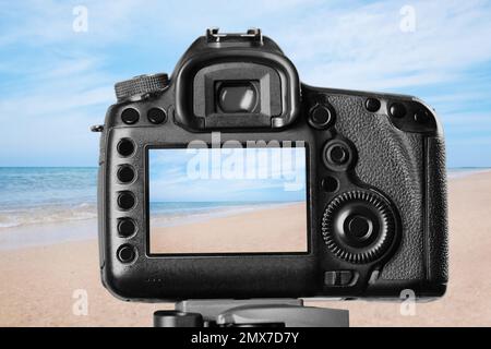 Recording beautiful view of seashore on professional video camera Stock Photo