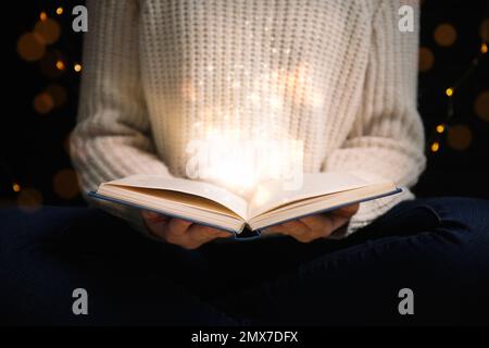 Woman with magic book, closeup. Fairy tale Stock Photo