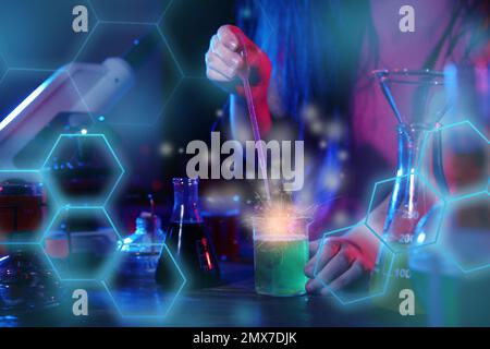 Child doing chemical research in laboratory, closeup Stock Photo