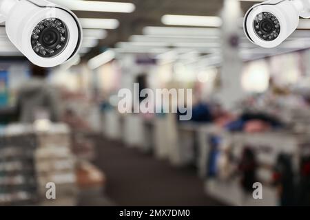 Modern CCTV security cameras in shopping mall. Guard equipment Stock Photo