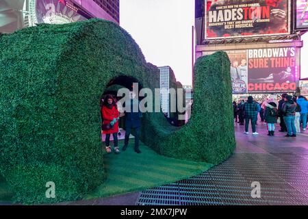 Tourists crowd “Love's h|Edge”, the winner of the 15th Annual Times Square Love & Design Competition in Times Square in New York on Wednesday, February 1, 2023. Designed by Almost Studio, the Valentine’s Day sculpture consists of heart-shaped “hedges” giving visitors a maze-like secret garden, and lots of selfie opportunities. The sculpture will be on display through February 28.(© Richard B. Levine) Stock Photo