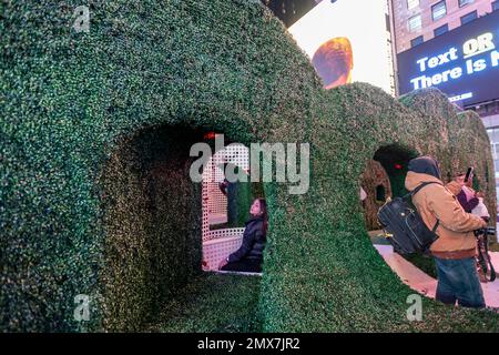 Tourists crowd “Love's h|Edge”, the winner of the 15th Annual Times Square Love & Design Competition in Times Square in New York on Wednesday, February 1, 2023. Designed by Almost Studio, the Valentine’s Day sculpture consists of heart-shaped “hedges” giving visitors a maze-like secret garden, and lots of selfie opportunities. The sculpture will be on display through February 28.(© Richard B. Levine) Stock Photo