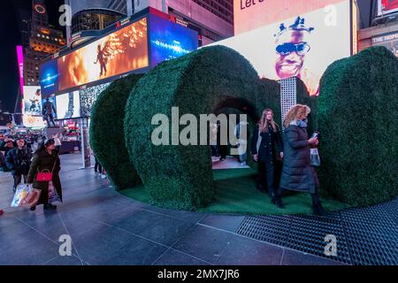 Tourists crowd “Love's h|Edge”, the winner of the 15th Annual Times Square Love & Design Competition in Times Square in New York on Wednesday, February 1, 2023. Designed by Almost Studio, the Valentine’s Day sculpture consists of heart-shaped “hedges” giving visitors a maze-like secret garden, and lots of selfie opportunities. The sculpture will be on display through February 28.(© Richard B. Levine) Stock Photo