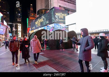 Tourists crowd “Love's h|Edge”, the winner of the 15th Annual Times Square Love & Design Competition in Times Square in New York on Wednesday, February 1, 2023. Designed by Almost Studio, the Valentine’s Day sculpture consists of heart-shaped “hedges” giving visitors a maze-like secret garden, and lots of selfie opportunities. The sculpture will be on display through February 28.(© Richard B. Levine) Stock Photo