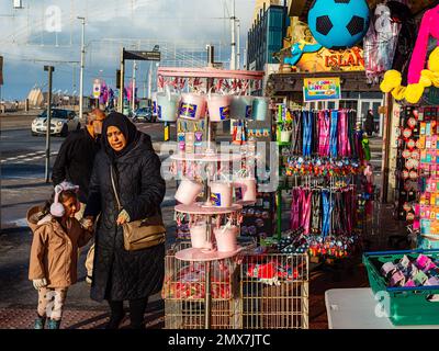 Asian family shopping at a seaside gift shop in Blackpool Stock Photo