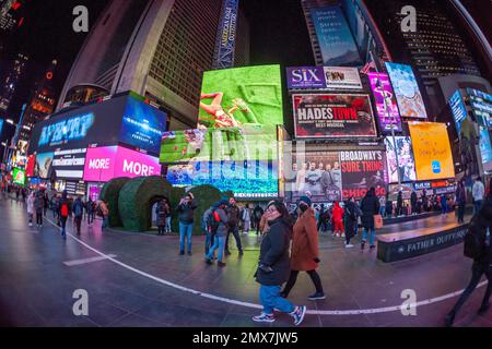 Tourists crowd “Love's h|Edge”, the winner of the 15th Annual Times Square Love & Design Competition in Times Square in New York on Wednesday, February 1, 2023. Designed by Almost Studio, the Valentine’s Day sculpture consists of heart-shaped “hedges” giving visitors a maze-like secret garden, and lots of selfie opportunities. The sculpture will be on display through February 28.(© Richard B. Levine) Stock Photo