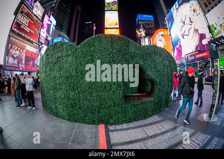 Tourists crowd “Love's h|Edge”, the winner of the 15th Annual Times Square Love & Design Competition in Times Square in New York on Wednesday, February 1, 2023. Designed by Almost Studio, the Valentine’s Day sculpture consists of heart-shaped “hedges” giving visitors a maze-like secret garden, and lots of selfie opportunities. The sculpture will be on display through February 28.(© Richard B. Levine) Stock Photo