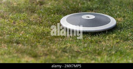 Close up of discuses on grass after impact on grass Stock Photo