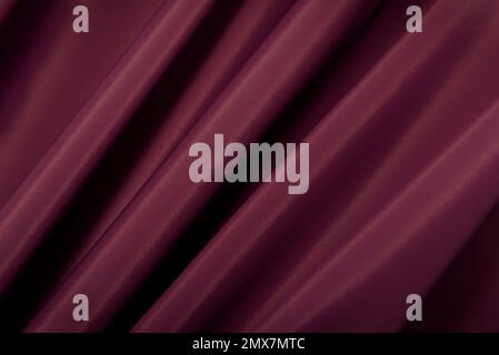 A piece of purple, magenta, red cloth. Fabric texture for background and design works of art, beautiful wrinkled pattern of silk or linen. A crumpled Stock Photo