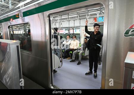 Dhaka, Bangladesh, on February 2, 2023 Passengers travel inside the Metro train from Uttara North to Agargaon in Dhaka, Bangladesh, on February 2, 2023 Stock Photo