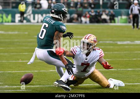 PHILADELPHIA, PA - JANUARY 29: Philadelphia Eagles wide receiver DeVonta  Smith (6) and San Francisco 49ers cornerback Charvarius Ward (7) battle for  the ball during the Championship game between the San Fransisco