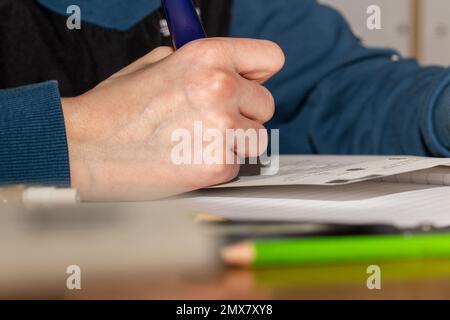 Symbol image school: Fifth grader doing his homework (model released) Stock Photo