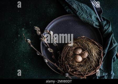 From above easter holiday dinner set with eggs on concrete table Stock Photo