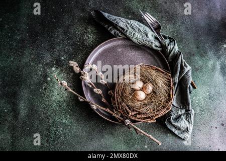 From above easter holiday dinner set with eggs on concrete table Stock Photo