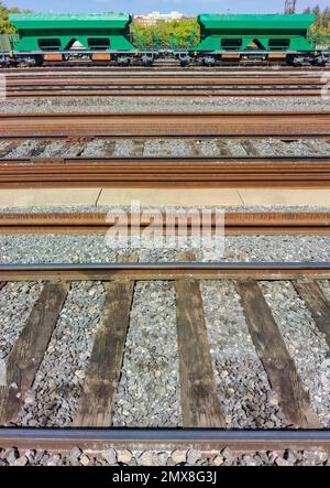 Merchandise wagons stopped on railway track. Rail freight transport Stock Photo