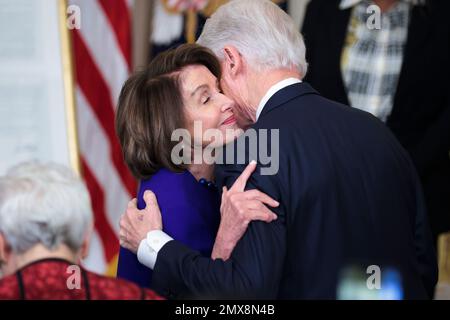 Washington, USA. 02nd Feb, 2023. Former President Bill Clinton greets Rep. Nancy Pelosi, during at an event to mark the 30th Anniversary of the Family and Medical Leave Act in the East ?Room of the White House in Washington, DC, on February 2, 2023. (Photo by Oliver Contreras/Sipa USA) Credit: Sipa USA/Alamy Live News Stock Photo