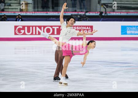 Haruna Murakami and Sumitada Moriguchi (JPN) perform during the Junior Pairs - Free Skating of the ISU Grand Prix of Figure Skating Final Turin at Palavela Stock Photo