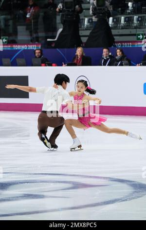 Haruna Murakami and Sumitada Moriguchi (JPN) perform during the Junior Pairs - Free Skating of the ISU Grand Prix of Figure Skating Final Turin at Palavela Stock Photo