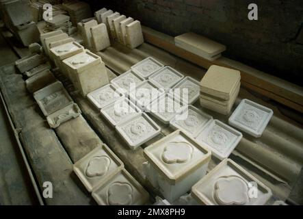 Medias, Sibiu County, Romania, approx. 2000. Clay tiles before the glazing and painting steps in the  'Teracota Medias' factory. Stock Photo