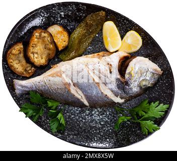 Delicious grilled gilthead bream with lemon Stock Photo