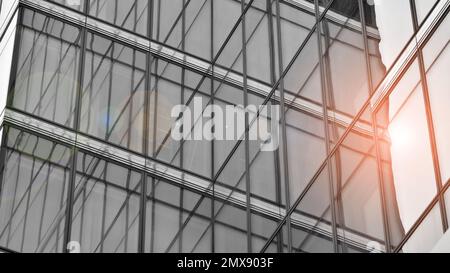 Modern architectural details. Modern glass facade with a geometric pattern. Contemporary corporate business architecture. Black and white toned image. Stock Photo